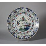 An 18th century English delft charger with flying bird and flowers decoration, 11 1/2" dia (