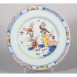 An 18th century English delft plate with bird, flower and fence decoration, 8 1/2" dia, c1750