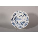 An 17th century London delft plate with chinoiserie landscape with seated figure decoration,