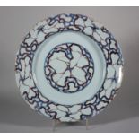 An 18th century London delft charger with cracked ice centre and border decoration, 11 3/4" dia (