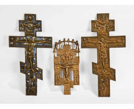 THREE 19TH-CENTURY RUSSION CRUCIFIXESone with blue enamel, largest 37.5cm long, smallest 26cm long