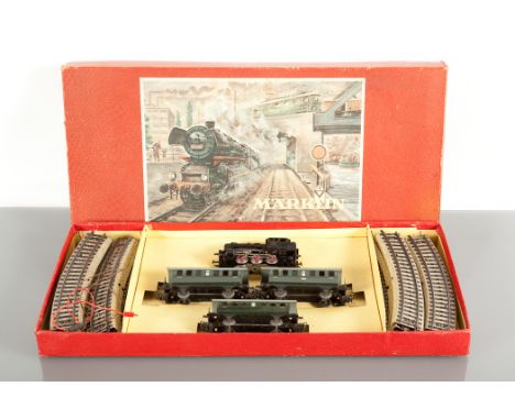 MARKLIN MODEL RAILWAY SET  circa 1959 with a transformer, coaches, trucks, vans, tanker wagons, track, buffers, signal and po