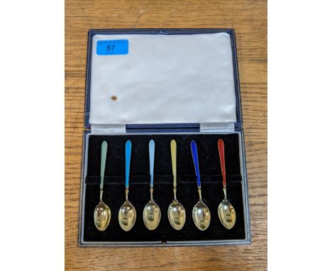 A cased set of six silver gilt spoons with enamelled handles, Birmingham 1964Location: 