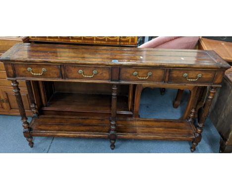 A reproduction hall table having four short drawers above six reeded columns and shelf below, 84cm h x 147.5cm wLocation: 