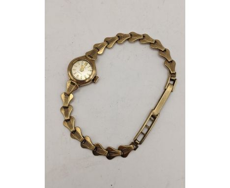 A vintage Avia 9ct gold manual wind wristwatch on a 9ct gold bracelet, 12.2gLocation: 