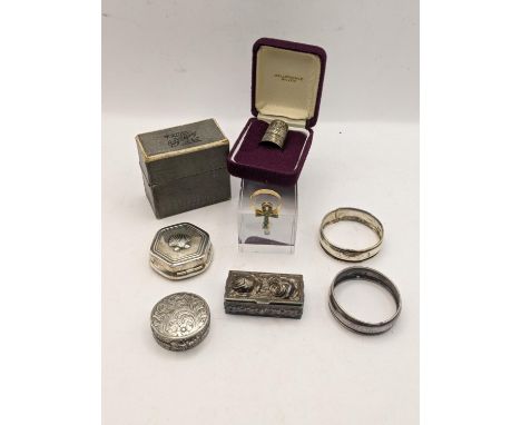 Mixed silver and white metal to include two silver napkin rings and trinket boxes, and others, along with a yellow metal Egyp