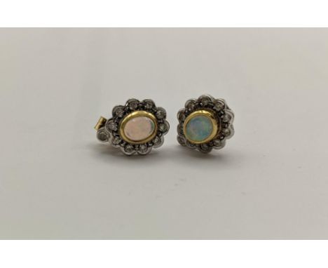 A pair of 18ct gold opal and diamond earrings stamped 750 having a gold earring backs, total weight 3.85gLocation: 