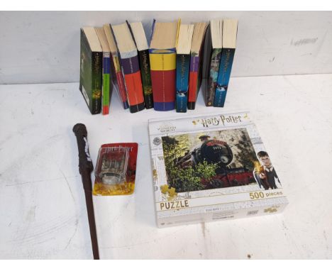 Harry Potter related items to include first edition books, jigsaw puzzle, a wand and a model of a schoolLocation: 