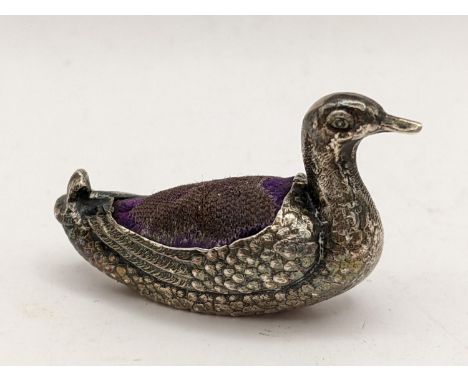 An early 20th century miniature silver pin cushion in the form of a duck by Sampson and Mordan, Sheffield 1906Location: 