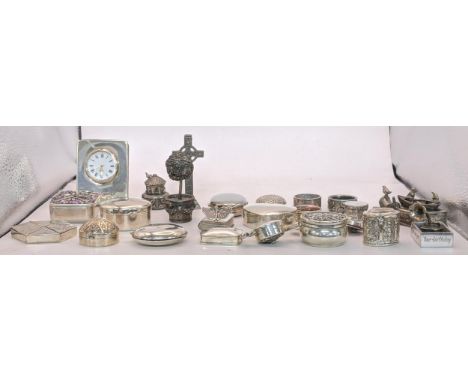 A collection of sterling silver and white metal pill boxes, also including a desk clock on an easel frame in a silver case (s