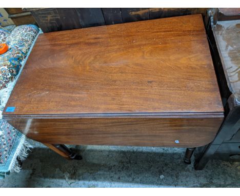 A Victorian mahogany Pembroke table on turned legs and ceramic castors 70cm x 81cm x 52cm (when unextended) x103cm when exten