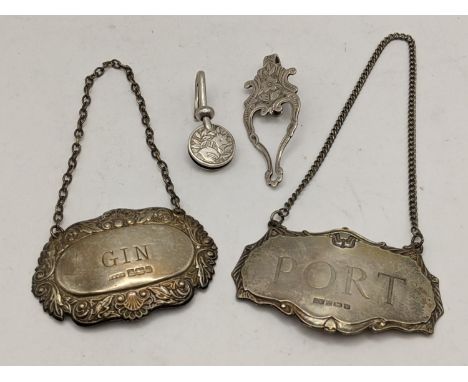 An Edwardian silver napkin hook together with two silver decanter labels and other items, 33.4gLocation: 