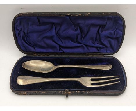 A matched silver Christening fork and rat tail spoon, in a fitted case, 80.2gLocation: 