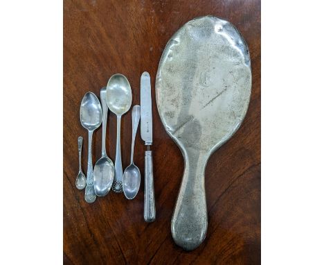 Mixed silver to include Georgian and later spoons, 72.5g, together with a silver handled knife and silver handled mirrorLocat