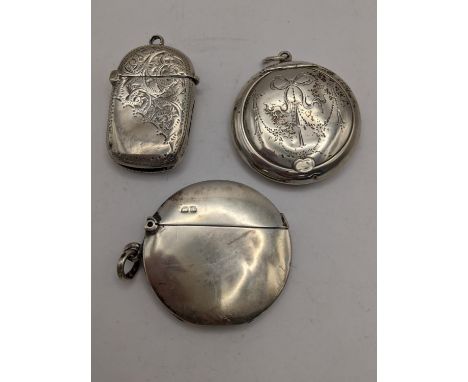 Two late 19th/early 20th century silver vesta cases together with a silver pill box, 42gLocation: 