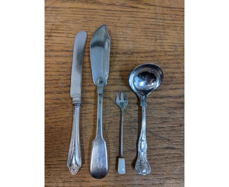 Small pieces of silver to include a miniature soup ladle with a fish knife, a butter knife and a pickle fork with mother of p