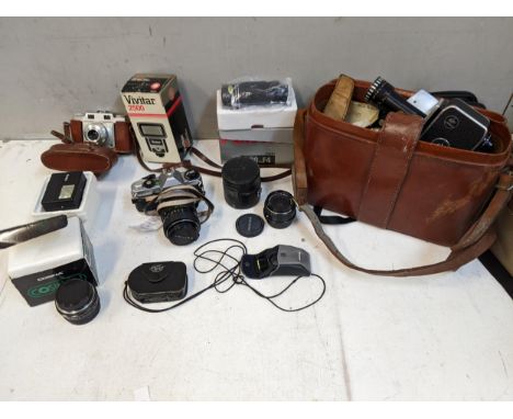 Photographic equipment to include a Rollei flash, a Pentax MG lenses, accessories, and a Bolex cine camera, and a truncheon L