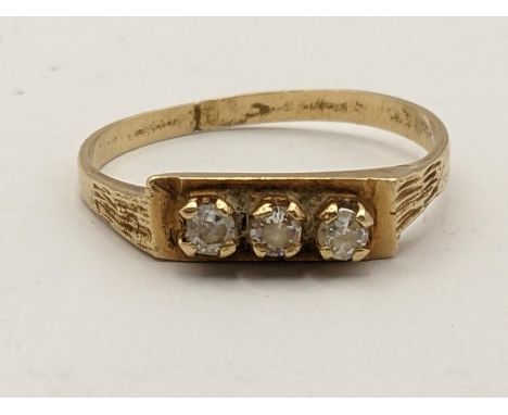 A 14ct gold three stone paste ring, 1.7gLocation: 