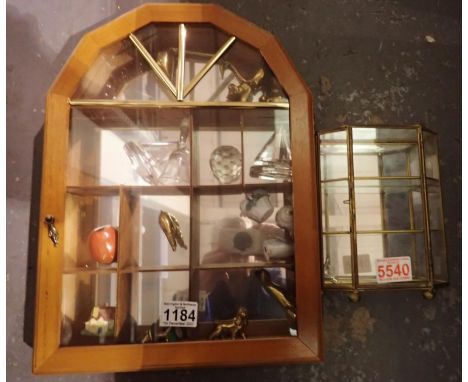 Two display cases with brass and ceramic ornaments. Not available for in-house P&amp;P 