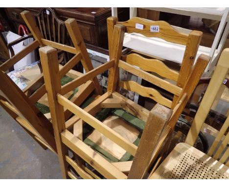 Set of four stained pine ladder back chairs. Not available for in-house P&amp;P 