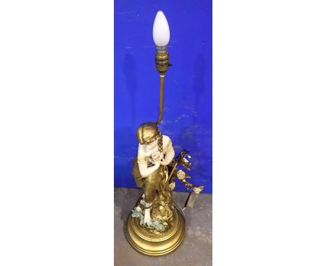 Figural table lamp signed L. Fliloreuix, H: 90 cm. All electrical items in this lot have been PAT tested for safety and have 