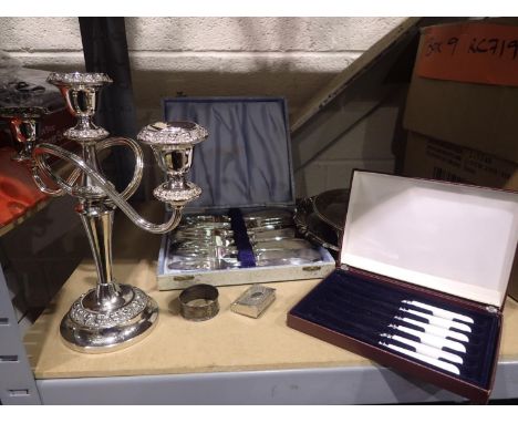 Collection of silver plate including three sconce candelabra vesta case and hallmarked silver napkin ring. Not available for 