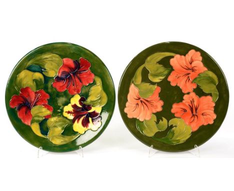 TWO MOORCROFT HIBISCUS PLATES, DESIGNED BY WALTER MOORCROFT,  C1970, 31CM D, IMPRESSED MARKS, BLUE OR GREEN PAINTED INITIALS 