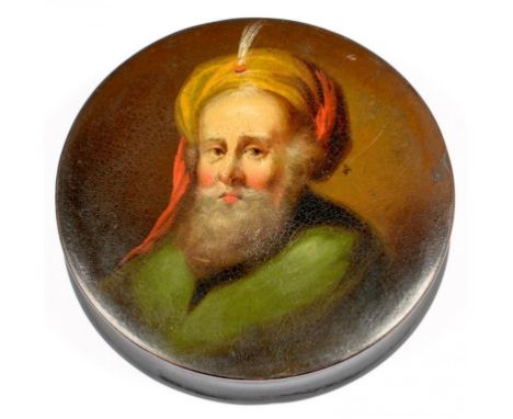 A PAPIER MACHE SNUFF BOX AND COVER, THE COVER PAINTED WITH THE HEAD OF A BEARDED MAN IN A TURBAN, 9CM D, C1840