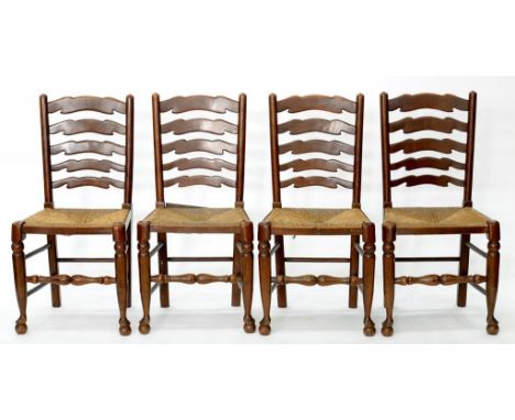 A SET OF FOUR OAK LADDER BACK DINING CHAIRS WITH REEDED SEATS, EARLY 20TH C