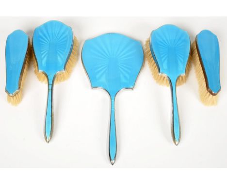 A BRIGHT BLUE GUILLOCHE ENAMEL FIVE PIECE BRUSH SET