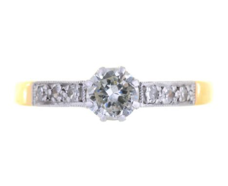 A DIAMOND SOLITAIRE RING WITH ROUND BRILLIANT CUT DIAMOND AND MILLEGRAIN SET DIAMOND SHOULDERS, marked 18ct PLAT, 1.8G,  SIZE