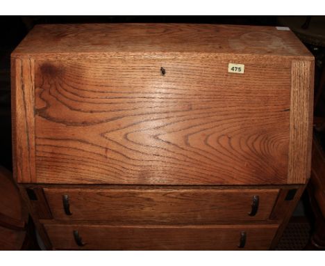 An oak bureau, nest of tables, a glazed coffee table and a barometer