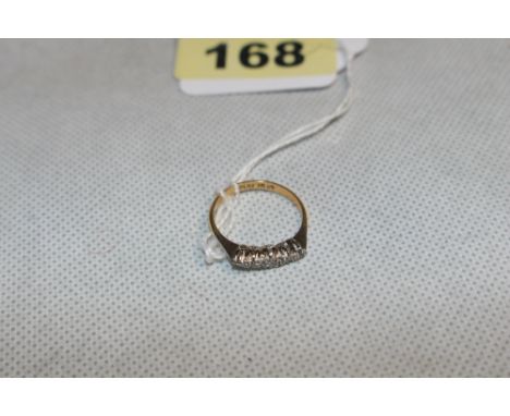 A five stone diamond ring. In gold marked 18ct. Size N