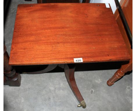 A George III mahogany reading stand with hinged top and tripod support