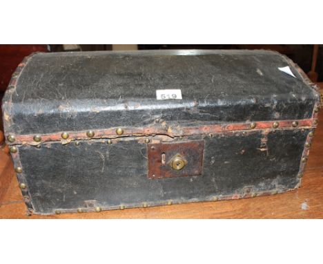 A 19th Century black leather covered trunk with domed lid. 20' wide
