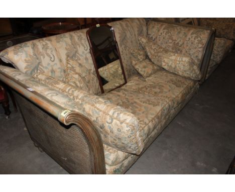 A French style sofa with bergere arms. 81' wide