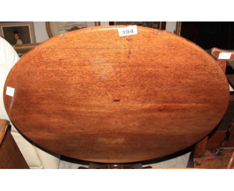 A 19th Century oak tripod table. 27' diam. 