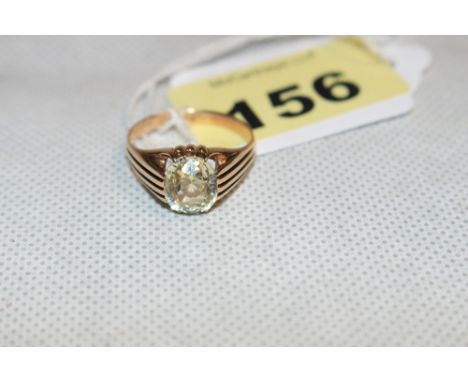 A lemon quartz solitaire ring, the oval stone 3 carats approx. In gold but apparently unmarked. Size P