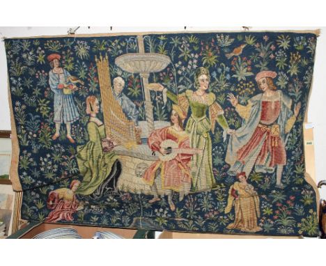 A hand-worked woolwork tapestry depicting figures in a garden. 40' x 52'