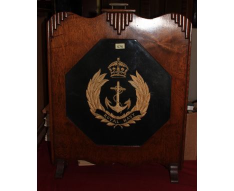 A 1930s oak firescreen embroidered with the crest of the Royal Navy