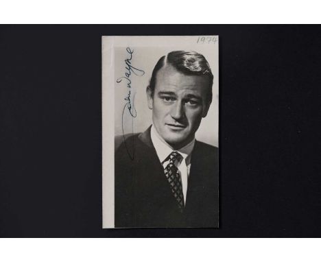 John Wayne (1907-1979): originally named Marion Robert Morrison, nicknamed The Duke, American Actor, a signed portrait photog