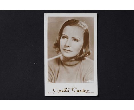 Greta Garbo (1905-1990): Swedish-American actress and Academy Award winner, a signed photographic portrait postcard, in black