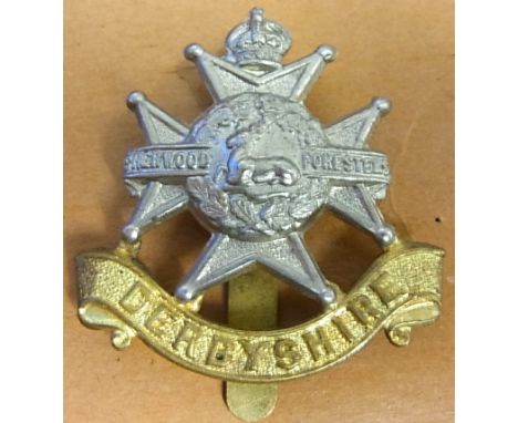 Army Ordnance Corps WWI Cap badge, (Gilt Brass) With a damaged slider.