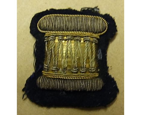 British Army Bandsman 'Drummers' Trade Patch in gold bullion with black backing.