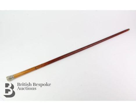 Early 20th century sword stick, with engraved blade, approx 68 cms, encased in a wood, with a white-metal end cap, approx 91 