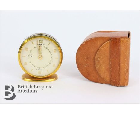 Jaeger le Coultre vintage travelling alarm. The alarm having a white enamel face with gold Arabic and baton markers, in the o