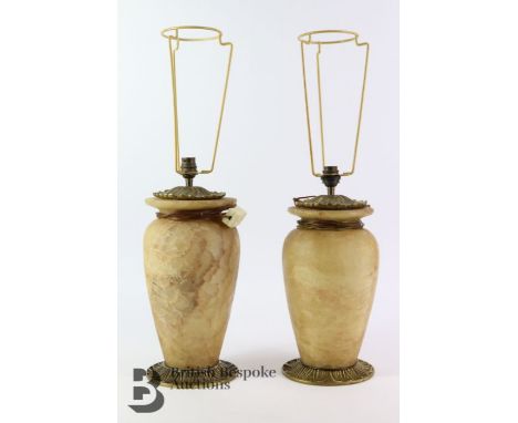 Pair of alabaster lamp bases, with brass fittings, approx 33 and 31 cms. (af)May Sale 12/05/2022The larger of the two shows s