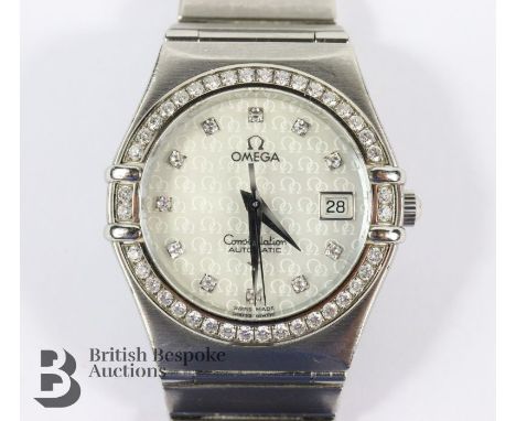 Ladies Omega stainless steel and diamond Constellation Automatic wrist watch. The watch having a silvered Omega monogram dial