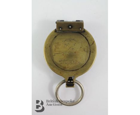 WWII era brass German Officers marching compass, stamped BUSCH DRGM 12&nbsp;Jäger&nbsp; Reg 58.19. The compass bears a person