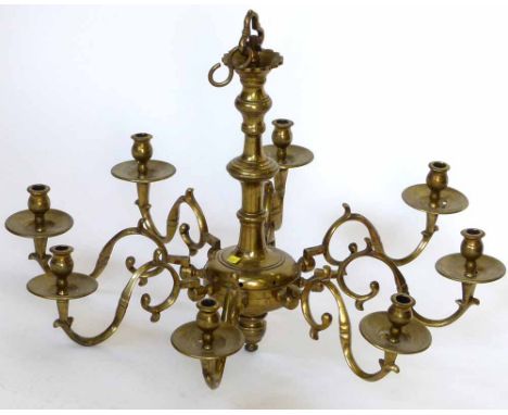 Cast brass hanging light of eight scrolled candle arms, diameter 70cm, height of shaft 50cm.
 
Condition report: drilled afte